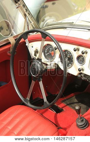 a Dashboard of a vintage sports car