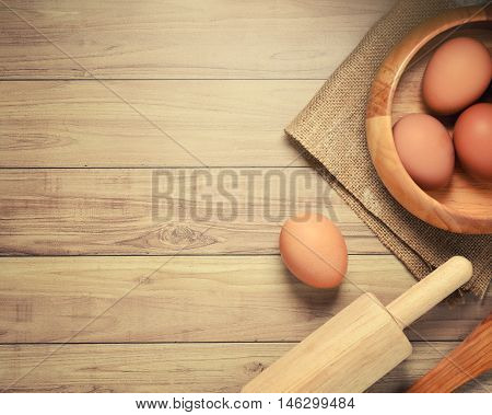 Eggs on wooden backgroundEggs on wooden background. Top view concept