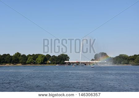 HAMBURG, GERMANY - AUG 26: Fountain at Alster Lake in Hamburg, Germany, as seen on Aug 26, 2016. In the city center, the Alster river forms two lakes, both prominent features in Hamburg's cityscape.