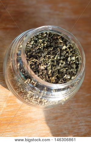 Tea leaves for brew with hot water in clear bottle