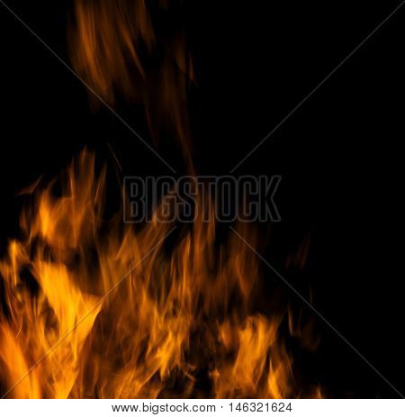 Photo of hot sparking live-coals burning spark of bonfire.