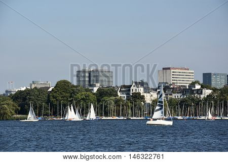HAMBURG, GERMANY - AUG 26: Sailboats on Lake Alster in Hamburg, Germany, as seen on Aug 26, 2016. Hamburg was founded at the mouth of Alster river in the 9th century and has been used as a port since.