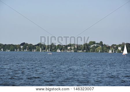 HAMBURG, GERMANY - AUG 26: Sailboats on Lake Alster in Hamburg, Germany, as seen on Aug 26, 2016. Hamburg was founded at the mouth of Alster river in the 9th century and has been used as a port since.