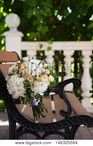 Beautiful Wedding Bouquet On A Wooden Bench