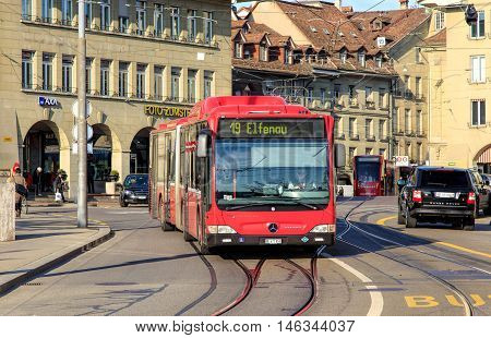 Bern, Switzerland - 29 December, 2015: pedestrians and traffic on Casinoplatz square. The city of Bern is the capital of Switzerland and the fourth most populous city in Switzerland.
