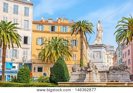 AJACCIO FRANCE - MAY 2 2013: The monument of Napoleon in Roman garb surrounded by stone lions and ornamental garden located in Place Foch on May 2 in Ajaccio.