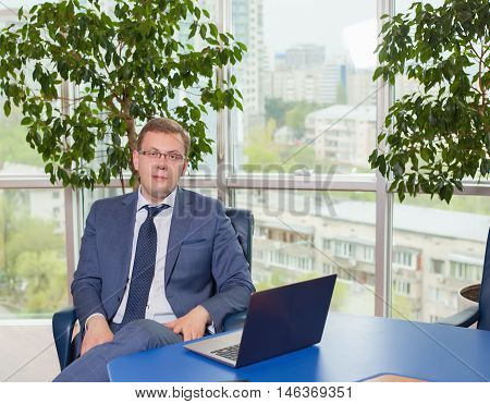 Businessman sitting at a desk in the office