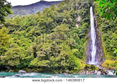 Waterfall In The Forest In Westland National Park, New Zealand