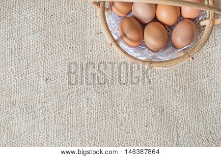 Eggs In Bamboo Basket On Jute Sack