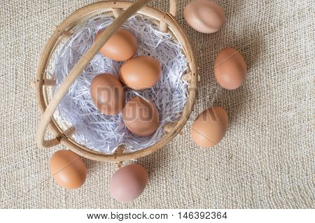 Eggs In Bamboo Basket On Jute Sack