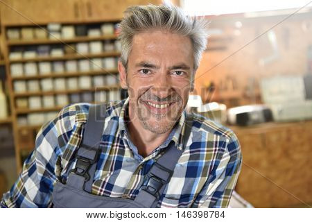 Carpenter working wood in workshop