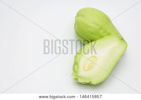 Sliced fresh Chayote and half isolated on white background.
