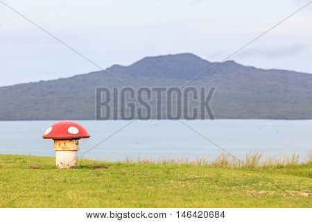 The decorated mushroom vents with blurred Rangitoto Island background Auckland New Zealand.