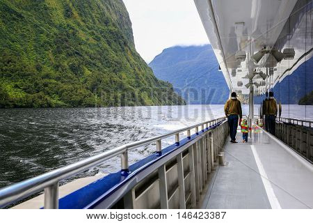 Father With Daughter Walking On The Deck Of Touring Boat. New Zealand