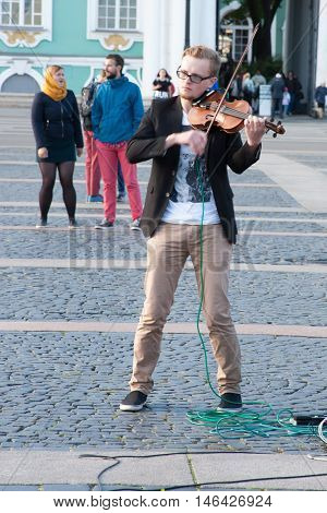 St. Petersburg, Russia-september 09,2016: The Street Musician Plays On The Street Of St. Petersburg.