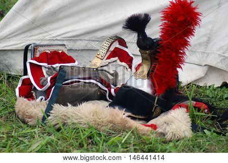 BORODINO MOSCOW REGION - SEPTEMBER 04 2016: Helmets shown at Borodino battle historical reenactment in Russia. Color photo. Reenactors belongings.