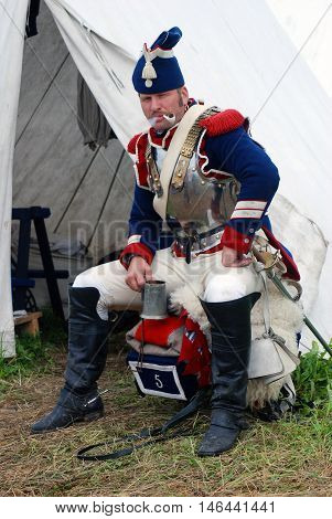 BORODINO MOSCOW REGION - SEPTEMBER 04 2016: Reenactor dressed as Napoleonic war soldier at Borodino battle historical reenactment in Russia. Color photo.