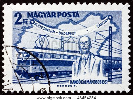 HUNGARY - CIRCA 1968: a stamp printed in Hungary shows Kando Statue Miskolc Kando Locomotive and Map of Hungary Kalman Kando Engineer and Inventor circa 1968