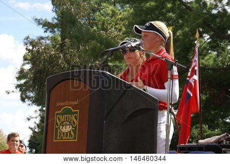 SMITHS FALLS ON CANADA SEPTEMBER 09 2016 - A 50 Editorial Image Series of Pro Golf Sensations Brooke M. Henderson and her sister Brittany Henderson giving a speech in front of their Hometown of Smiths Falls shortly after the efforts in the Summer Rio Olym