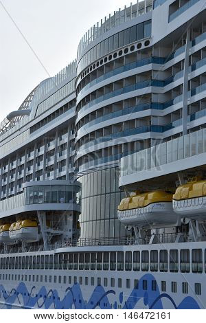 HAMBURG, GERMANY - AUG 27: AIDAprima cruise ship docked in Hamburg, Germany, as seen on Aug 27, 2016. The ship was christened on 7 May 2016 in Hamburg, as part of 827th Hamburg Port Anniversary.