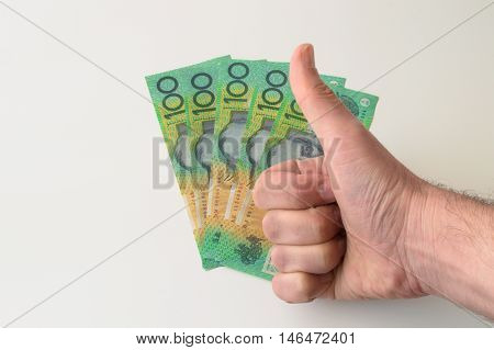 Man's hand on 500 Australian Dollar banknote