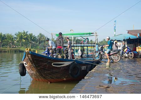 HOI AN, VIETNAM - JANUARY 04, 2016: Ferry from the town wharf on the river Thu Bon. Tourist landmark of the city Hoi An, South-East Asia