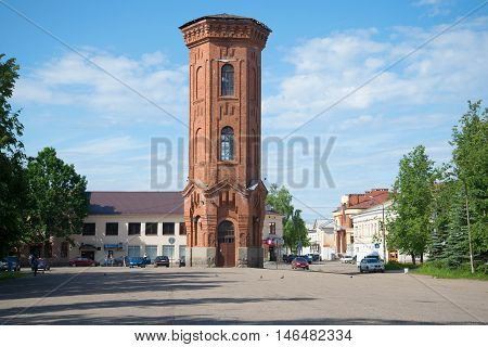 STARAYA RUSSA, RUSSIA - JUNE 02, 2016: View on the old water tower in the town square on a sunny june day. Historical landmark of the city Staraya Russa