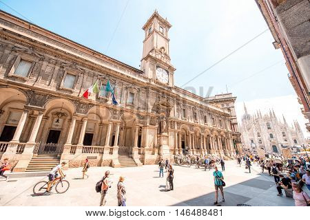 Milan, Italy - June 06, 2016: The Giureconsulti palace with clock tower on Mercanti square near Duomo square in Milan city center