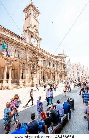 Milan, Italy - June 06, 2016: The Giureconsulti palace with clock tower on Mercanti square near Duomo square in Milan city center