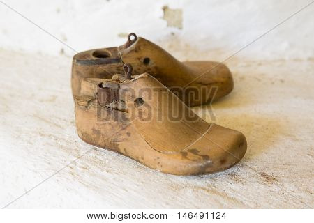 Time-worn, old wooden shoehorn for young children