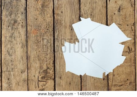 Clear paper cutting on a wood table