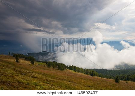 Dramatic evening in Gerlitzen Apls before stormAustria.Inverse weather and view of the mountains in Slovenia.