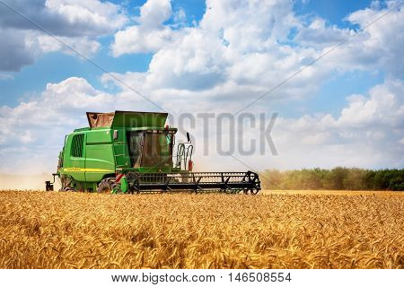 Dobrich Bulgaria - July 08: Modern John Deere combine harvesting grain in the field near the town Dobrich Bulagaria July 08 2016
