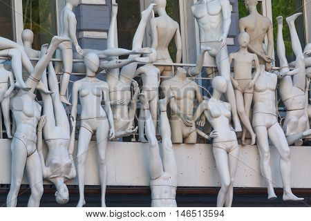 Many mannequins side by side on the balcony.