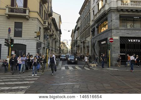 MILAN, ITALY - APRIL 13 2015: Via Montenapoleone street in Milan with people around at day time