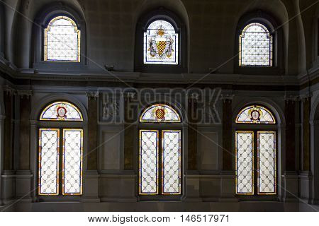 MILAN, ITALY - APRIL 16 2015: Monumental colored glass windows of Palazzo Litta in Milan Italy