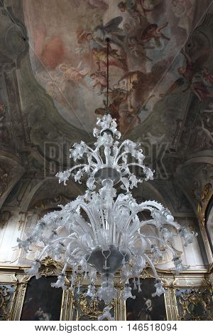 MILAN, ITALY - APRIL 16 2015: Room of Palazzo Litta in Milan ceiling decorated with fresco and a chandelier