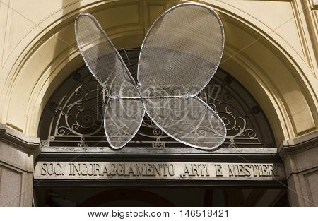 MILAN, ITALY - APRIL 16 2015: Entrance of the Societa incoraggiamento Arti e Mestieri in Milan Italy