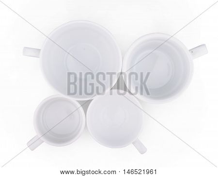 top view of white ceramic coffee cups isolated on white background