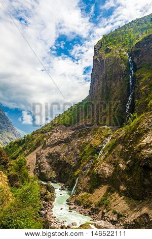 Landscape Mountains Hiking Himalayas.Beautiful View Waterfalls End Summer Season Background.Green Threes Cloudy Blue Sky Mountainous River.Nobody Image.Vertical Photo
