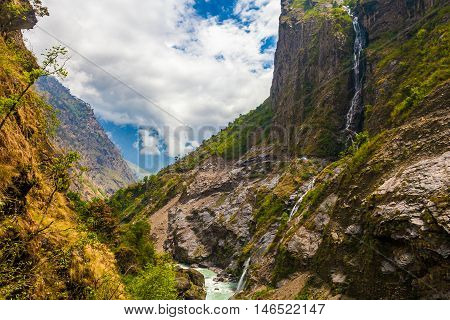 Landscape Mountains Hiking Himalayas.Beautiful View Waterfalls End Summer Season Background.Green Threes Cloudy Blue Sky Mountainous Rocks River.Nobody Image.Horizontal Photo