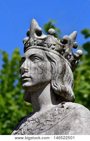 Poissy France - august 6 2016 : the statue of the king Saint Louis near the collegiate church