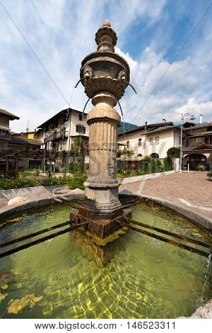 Detail of an ancient marble fountain (1553) in Levico Terme (Venezia Square) Trentino Alto Adige Italy Europe