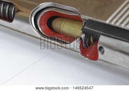 Pistol and ammunition on the white background.