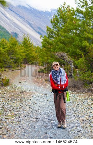 Portrait Young Pretty Girl Wearing Red Jacket Backpack Trail Mountains.Mountain Trekking Landscape Hikking Path View Background.Woman Happy Smiling Close Rock River.Horizontal Photo