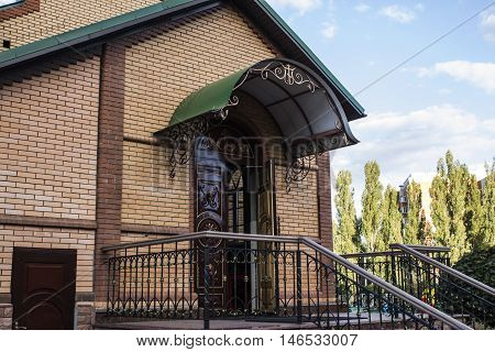Entrance to the church on a background of sky