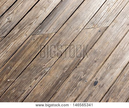 Diagonal weathered wooden plank background from boardwalk