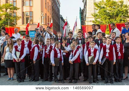 KRAKOW, POLAND - FEB 10, 2016: Unidentified participants of ceremony is the vow of first classes of the Jan III Sobieski High School (founded in 1883) at the Main Market Square near St.Mary Cathedral.