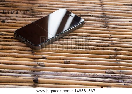 Moblie smart phone on wood table background
