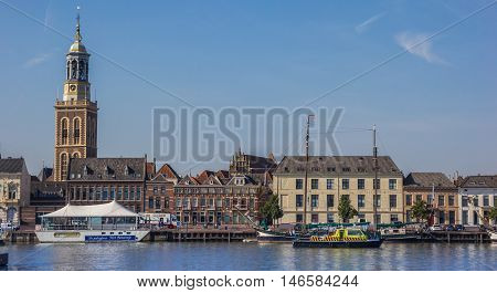 KAMPEN, NETHERLANDS - AUGUST 31, 2016: Waterfront and church tower of Kampen, The Netherlands